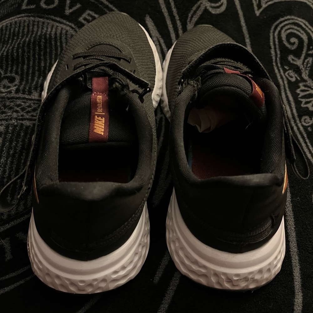 Nike walking/Running shoes for women width W with zipper on the side and Velcro.